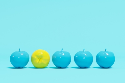 4 blue and one yellow apple